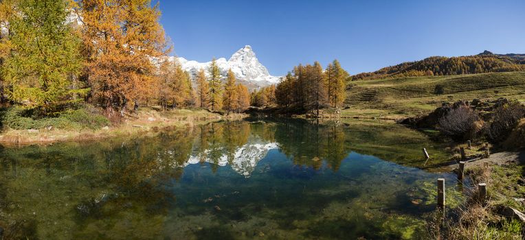 Matterhorn and Blue Lake in autumn sunny day, Aosta Valley