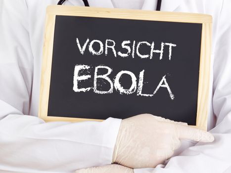 Doctor shows information: Ebola caution in german language