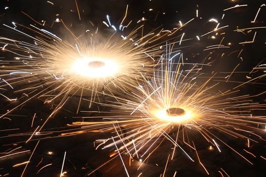 A firework / fire cracker called chakra / bhoo chakra looking like a rotating fireball, used during the traditional Diwali festival in India