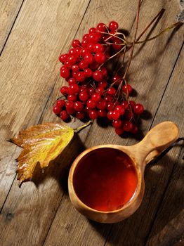 Ripe tasty viburnum and tea for medicine