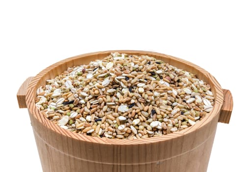 Mixed grains in wooden bucket
