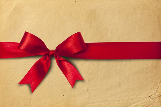 Red ribbon and bow on the cartoon box