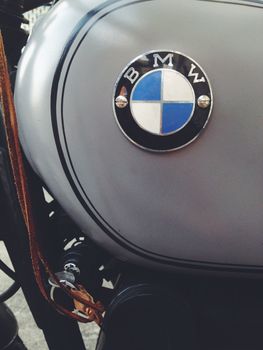 BANGKOK, THAILAND - JULY 23, 2014: The BMW-known logo at a historic BMW-Motorbike (Berlin-Germany). BMW is a German automobile, motorcycle and engine manufacturing company founded in 1916.