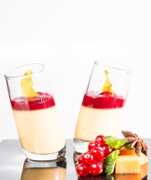 Dessert panna cotta with fresh berry on white background