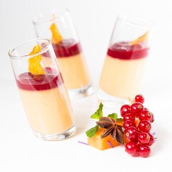 Dessert panna cotta with fresh berry on white background