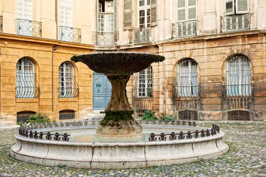 Ancient fountain in Aix en Provence town, South France