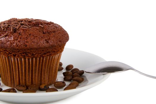 Chocolate muffin on a white plate isolated on white background