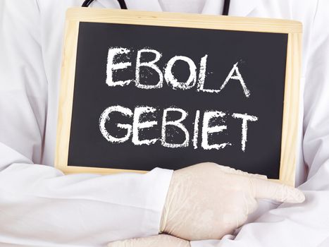 Doctor shows information: Ebola territory in german language