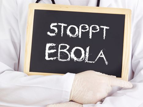 Doctor shows information: stop Ebola in german language