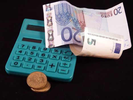Tax calculator on a pile of US dollar bills