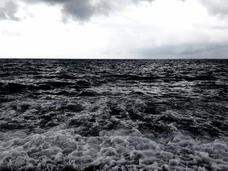 a dark rushing sea in Italy