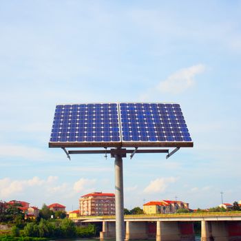 Solar panel in plain air, with town on the background