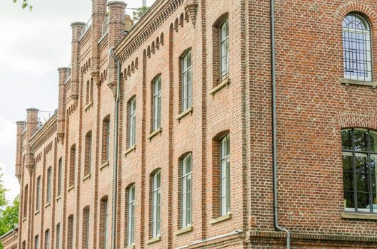 Historic old town building of brick after renovation for condominiums.