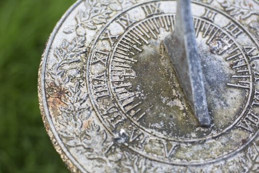 Close up of weathered  sundial in garden