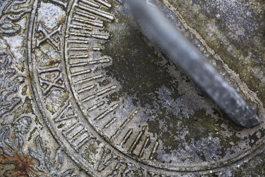 Close up of weathered  sundial in garden