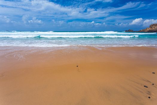 Atlantic ocean beach with sand and waves, Portugal