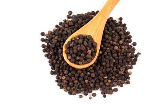 Black pepper with wood spoon isolated on the white background