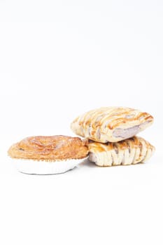 bread on white isolated background.Bread baked with a sweet fruit filling inside.