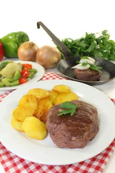 Ostrich steak with baked potatoes and peppers - artichokes - Vegetables