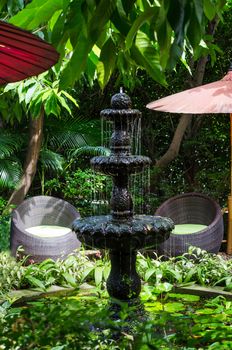 Classic style stone fountain in the garden