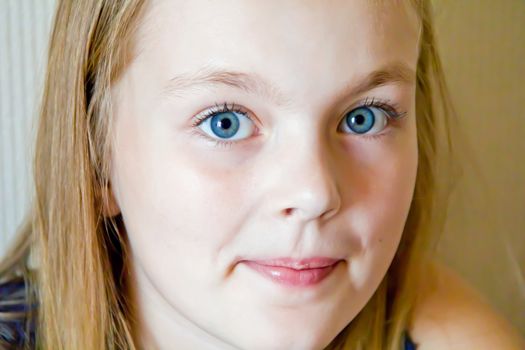 Photo of cute girl with big blue eyes