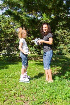 Photo of mother and daughter playing in summer