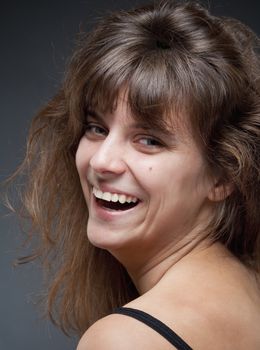 Portrait of a Young Woman with Brown Hair Smiling