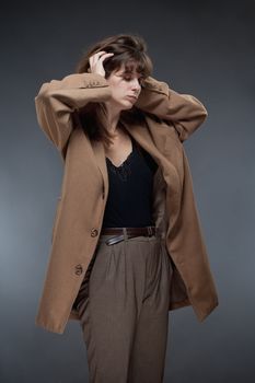 Portrait of a Young Woman in Brown Coat