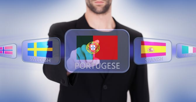 Hand pushing on a touch screen interface, choosing language or country, Portugal