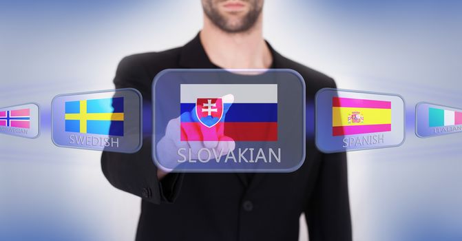 Hand pushing on a touch screen interface, choosing language or country, Slovakia