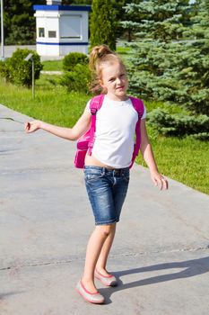 Cute girl go to school with pink knapsack