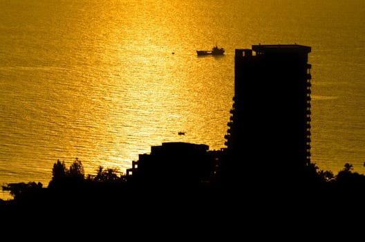 Silhouette view Hua Hin city at sunrise beautiful scenery town seaside in Prachuap Khiri Khan Province of Thailand.