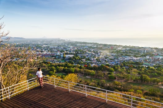 Traveler on view point Hua Hin city at sunrise beautiful scenery town seaside in Prachuap Khiri Khan Province of Thailand