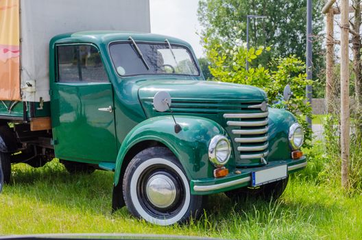 Rheine, Nrw, Germany - March 13, 2014: In Rheine on the main road out of town. Old truck parked on the street, to advertising. Oldtimer constructed from the year 1954 to 1961 in the former GDR in the VEB Barkas works Karl Marx Stadt. 
This three-quarter-ton truck is the smallest of the former GDR have been.
