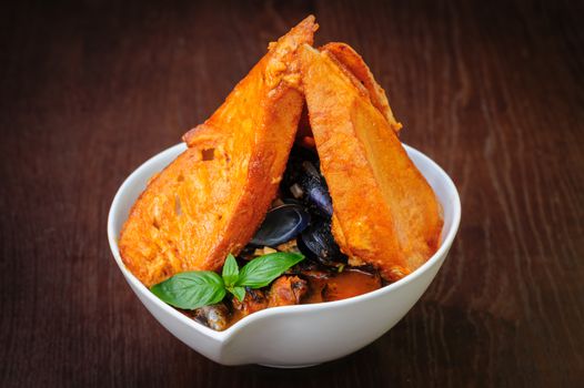 mussel and ather sea fruits soup with toasted bread