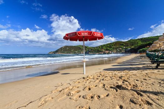 Lifeguard's umbrella on the Biodola beach, Elba Island, Italy