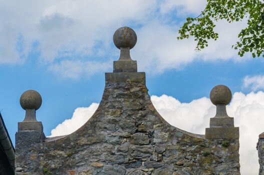 Detail of an old building pediment stone in Germany