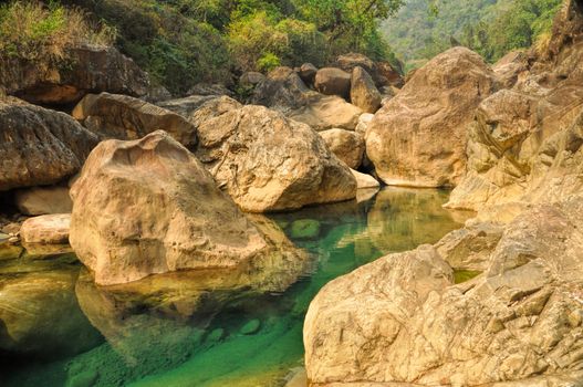 Clear turquoise water of stream in Meghalaya, India