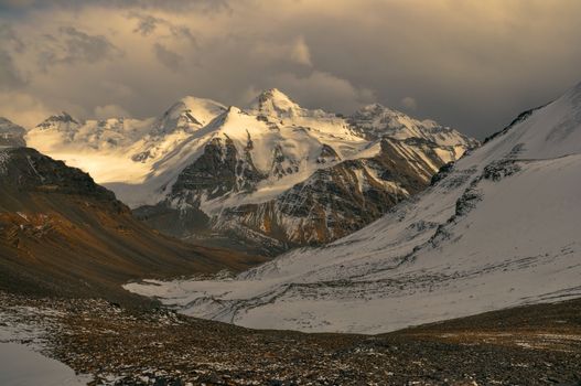 Scenic view of cloudy Wakhan valley in Tajikistan with snowy mountain peaks of Pamir and Karakoram