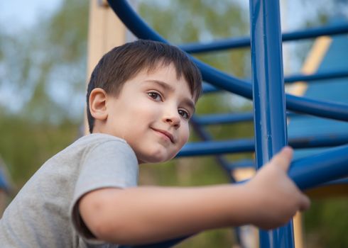 Portrait of a boy playing on the playground