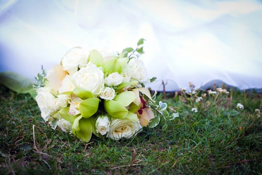 Wedding bouquet with white roses and orchids