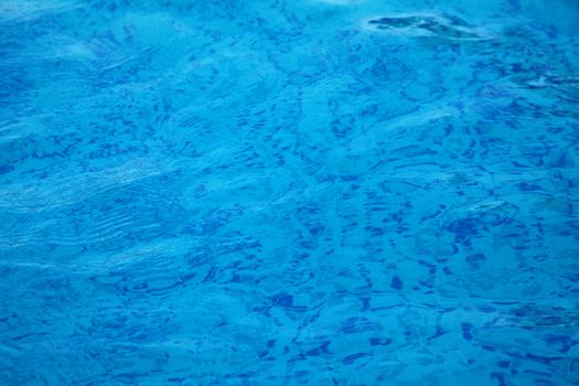 Blue water in a swimming pool. Background