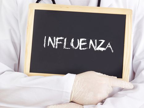 Doctor shows information on blackboard: influenza
