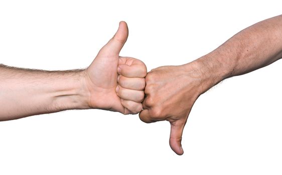 Clash of the thumbs up and thumbs down hand signs isolated on white