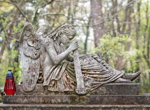 Old statue on grave in the Lychakivskyj cemetery of Lviv, Ukraine.
