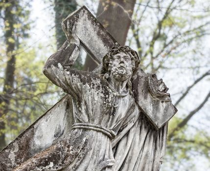 Old statue on grave in the Lychakivskyj cemetery of Lviv, Ukraine.