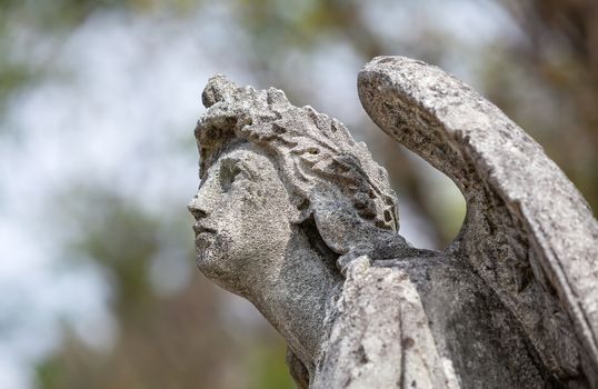 Old statue on grave in the Lychakivskyj cemetery of Lviv, Ukraine.