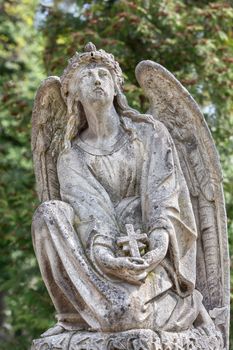 Old statue on grave in the Lychakivskyj cemetery of Lviv, Ukraine.