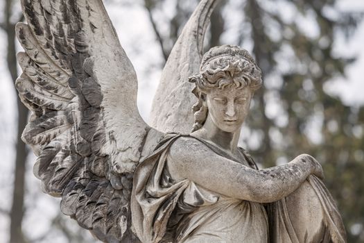 Old statue on grave in the Lychakivskyj cemetery of Lviv, Ukraine.