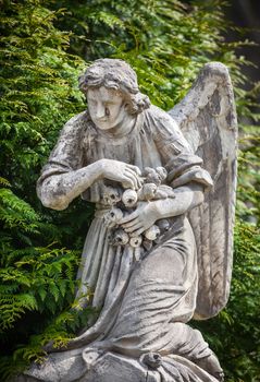 Old statue on grave in the Lychakivskyj cemetery of Lviv, Ukraine.